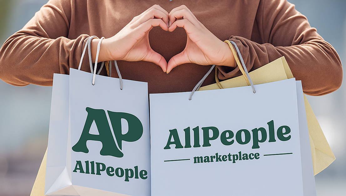 Shopper with hands forming a heart and AllPeople branded shopping bags.