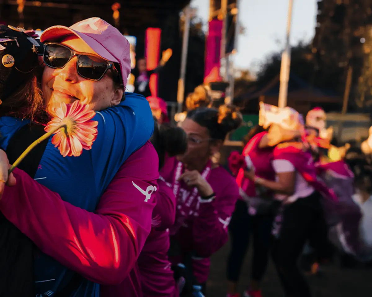 Supporters embracing at a Susan G. Komen event